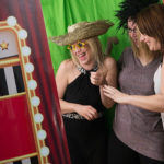 Picture demonstrates people using a Photo Booth in a Blog about which Booth to choose for their event.